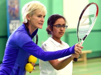 Judy Murray coaches a young girl 