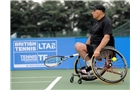 Two-time Paralympic champion and world No. 2 Peter Norfolk began his bid for a fifth British Open title by defeating fellow Briton John Parfitt 6-1, 6-0 to reach the quarter-finals.