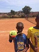 A youngster with Zsig mini orange tennis ball.