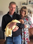 Club coach Ian Watson with his wife Jan and their new grandson.