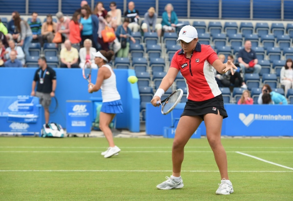 BIRMINGHAM, ENGLAND - JUNE 15:  Ashleigh Barty (R) and Casey Dellacqua of Australia in action during the Doubles Final during Day Seven of the Aegon Classic at Edgbaston Priory Club on June 15, 2014 in Birmingham, England.  (Photo by Tom Dulat/Getty Images)