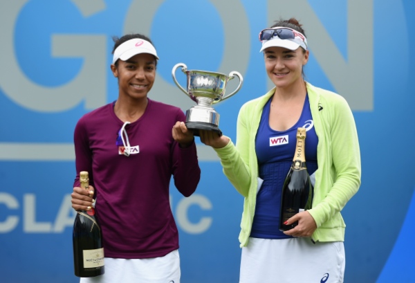 BIRMINGHAM, ENGLAND - JUNE 15:  Raquel Kops-Jones and Abigail Spears (R) of the United States pose with the trophy after the Doubles Final during Day Seven of the Aegon Classic at Edgbaston Priory Club on June 15, 2014 in Birmingham, England.  (Photo by Tom Dulat/Getty Images)