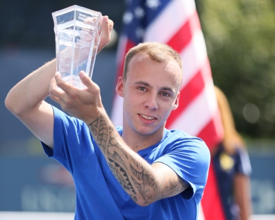 Andy Lapthorne holds the US Open trophy