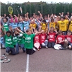 All children with their hands in the air