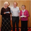 Jean Siney and Esme Laing are presented with a special award from John Hoffmann for their support of the Ladies Team.