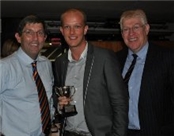 Mike james receives the Coach of the Year trophy from Andrew Jarrett and John Last