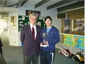 John Tucker, President, ECLTA presenting the Ladies Singles Winners Trophy to Virunee Viravong 