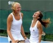 Stephanie Cornish and Jocelyn Rae share a joke on their way to victory