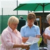 Littleton Tennis Club admiring their plaque