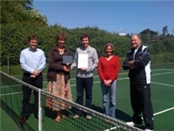 Simon Johnson presenting Tennis Clubmark to Swanmore's committee