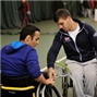 Photo features Paralympian Dave Phillipson (right) who will be hopefully lending a hand at the Wheelchair Tennis Open