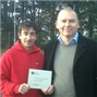 Lutterworth Head Coach Dave Lowden receiving the clubmark plaque from LTA Tennis Development Manager Paul Sheard