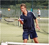 Andrew Castle, GMTV presenter practices before his turn on the court