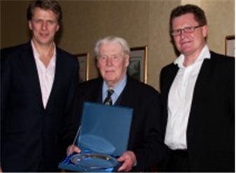 Dennis receiving his Special Achievement Award from Andrew Castle